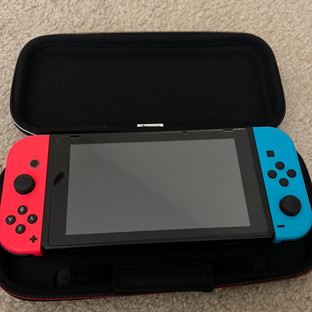 Nintendo Switch brand NEW WITH CASE and storage cases for games